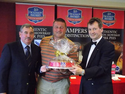 Stephen Hallam (right) and Club Captain Jack Inguanta (left) presenting Mark Lewis his prize for winning 'Nearest the Pie'